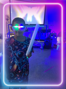 boy smiling with LED lights